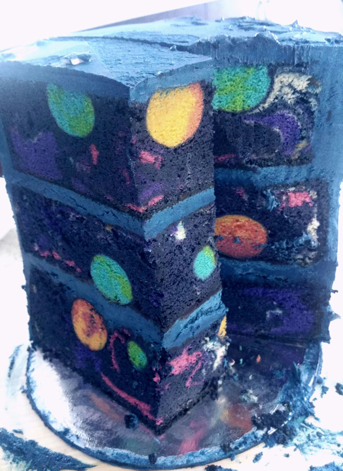 space-themed birthday cake slice