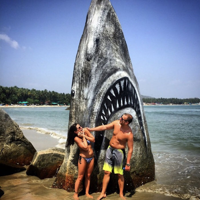 couple in front of great white shark jaws rock spray paint graffiti jimmy swift