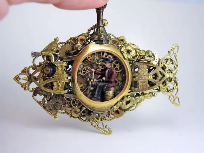 man in miniature worlds inside pocket watches and pendants
