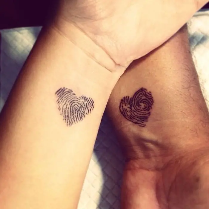 matching tattoos couple fingerprint hearts