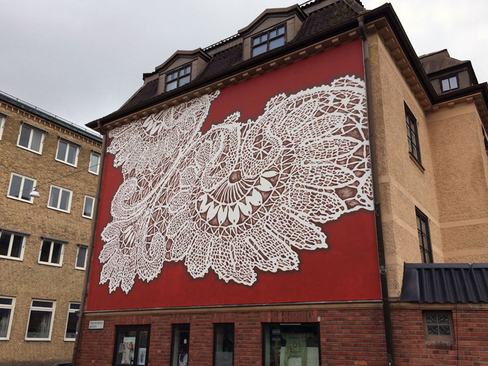 nespoon lacework murals boras sweden red background