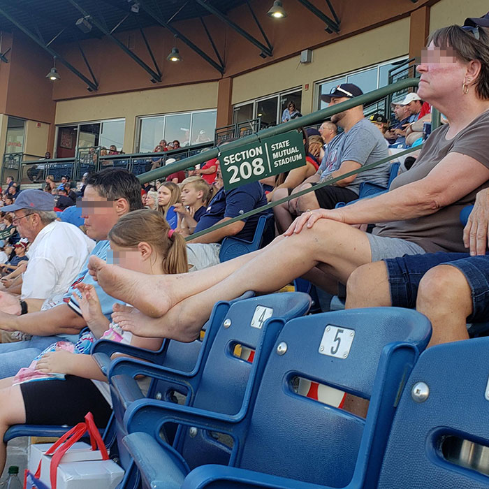 people being jerks feet up baseball game