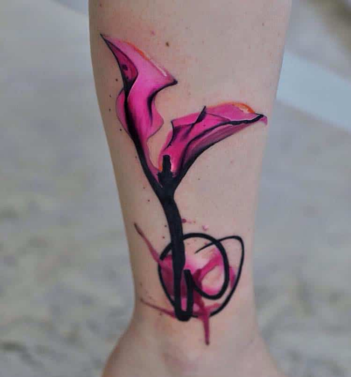 black and pink flower on lower leg best floral tattoo artists