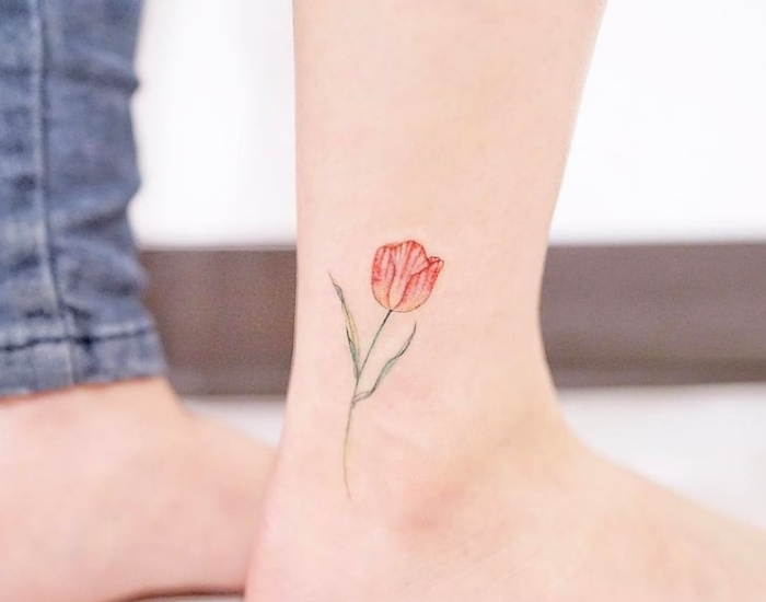 little flower near ankle best floral tattoo artists