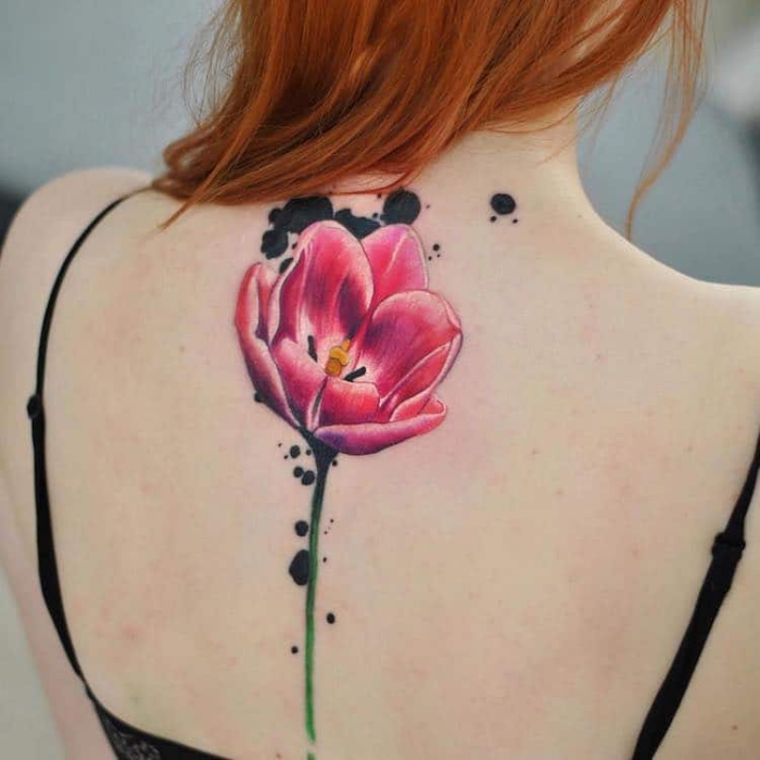 one flower with stem on back best floral tattoo artists