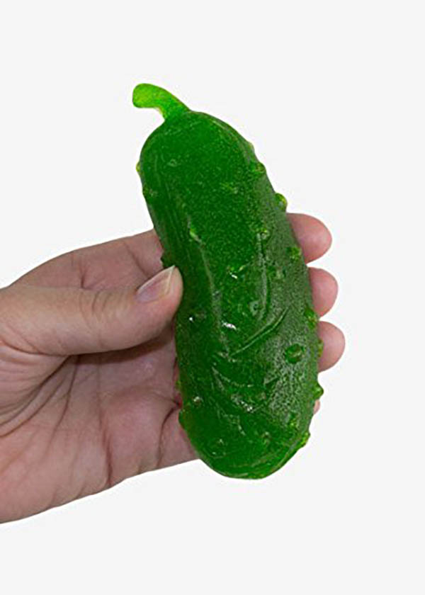 Gummy Pickle Held By Hand