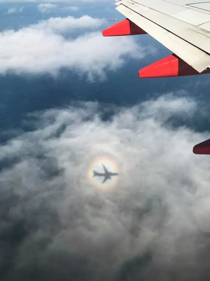 shadow optical illusions airplane rainbow