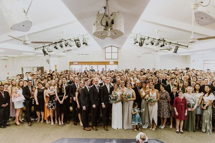 tall people with short people wedding photo