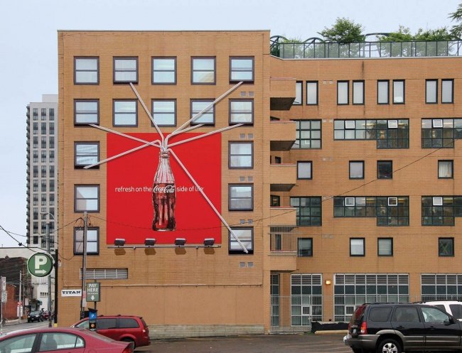 Coca-cola Billboard Featuring Seven Straws Extending Outwards from the Billboard