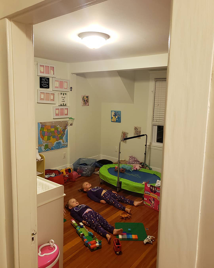 Daughters lie on the floor to charge their glow-in-the-dark PJs