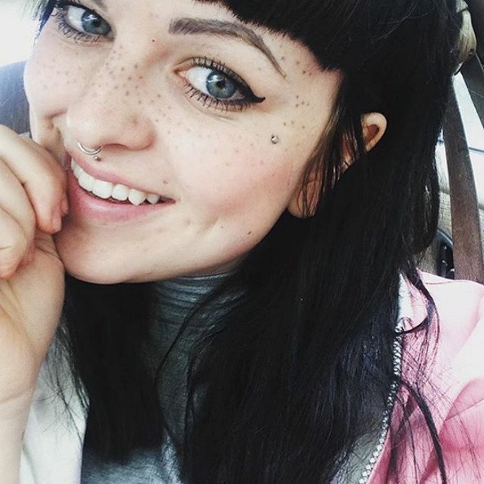 Lady with Black Hair, Nose Ring, and Freckle Tattoos on Face