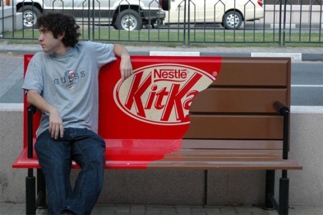 Man Sitting on Kitkat Bench