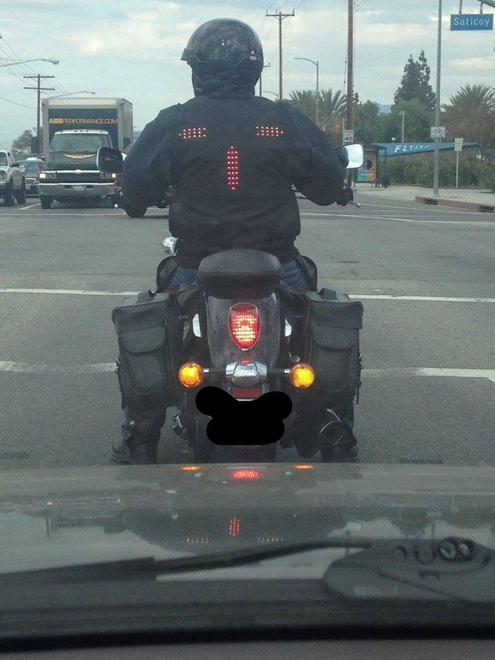 Man Wearing a Biker Jacket with Signal and Brake Lights