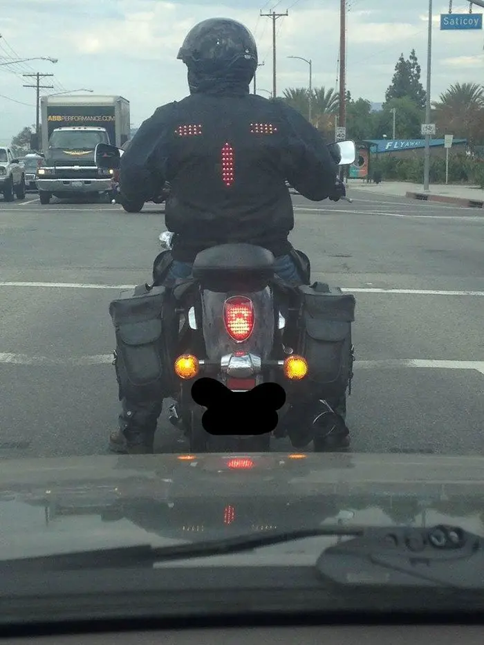 Man Wearing a Biker Jacket with Signal and Brake Lights