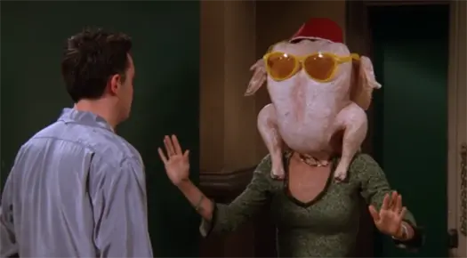 Monica wearing the giant turkey on her head