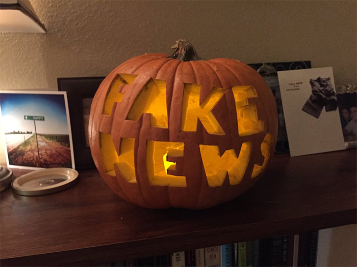 Pumpkin with Fake News Carving