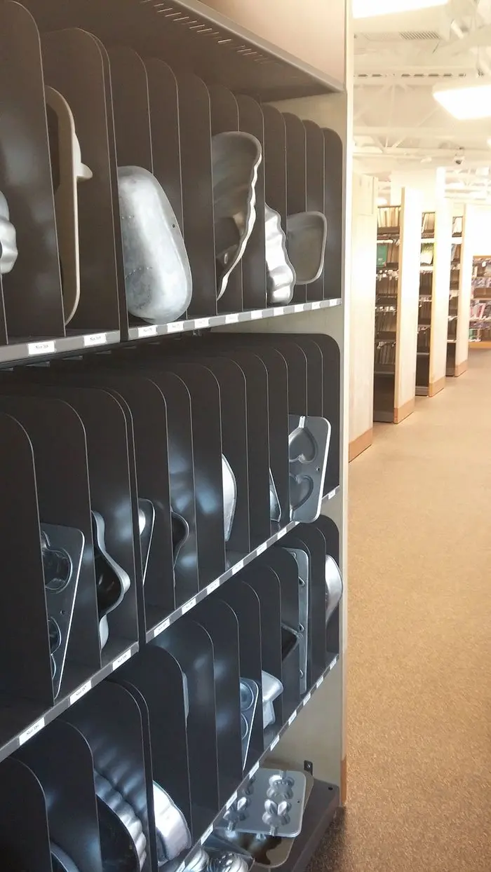 Shelf of Cake Tins and Brownie Molds at a Library