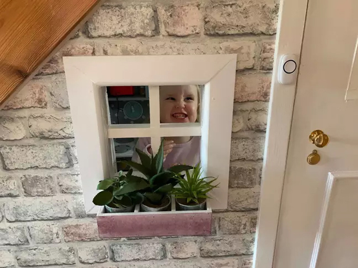 holly happy with her under stairs playground