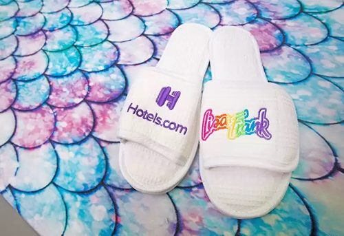 slippers at lisa frank-themed hotel room