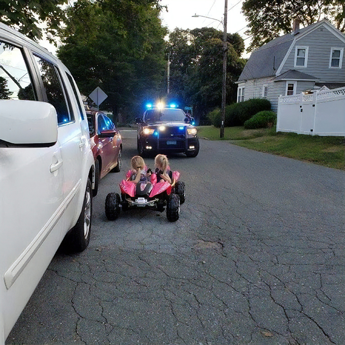 the sisters driving a pink toy car