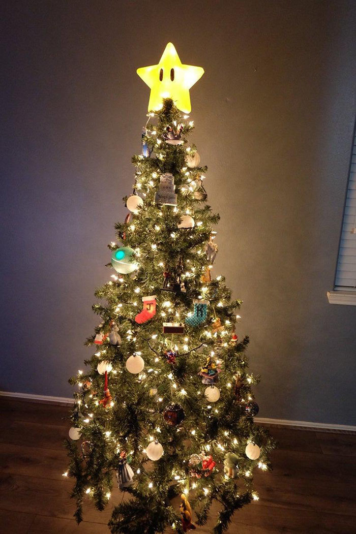 A Christmas Tree With the large Super Mario Tree Topper