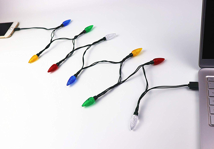Christmas Lights Phone Charger Connected to an iPhone and Laptop