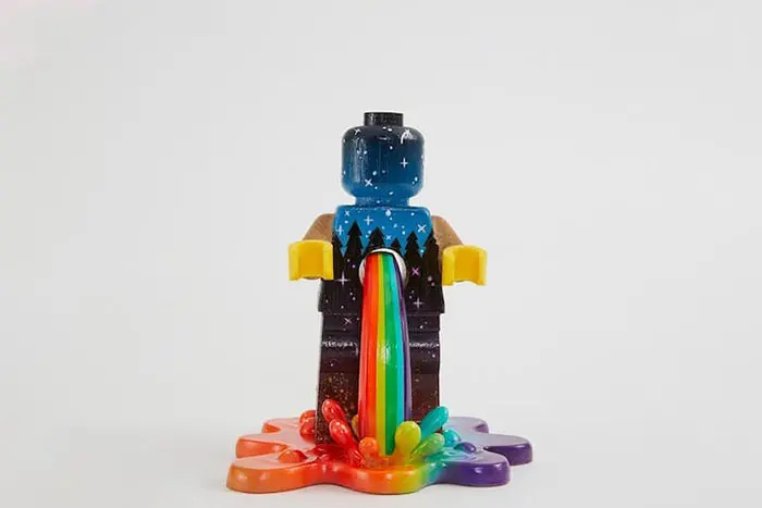 Customized LEGO Minifigure Painted with a Starry Night Sky and Tree Silhouttes with Rainwbow Burst