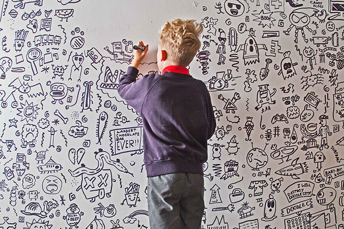 Joe Whale Drawing More Doodles on the Wall