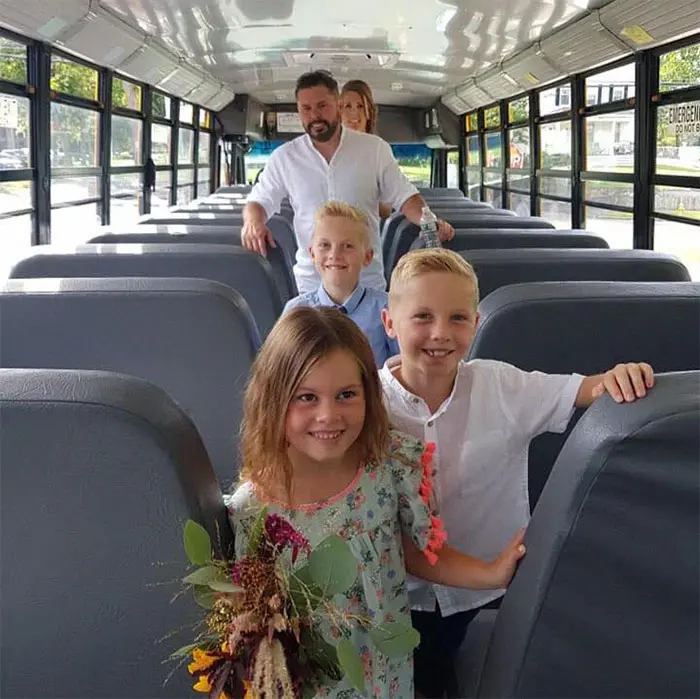 Joe Whale and His Family Inside a Bus