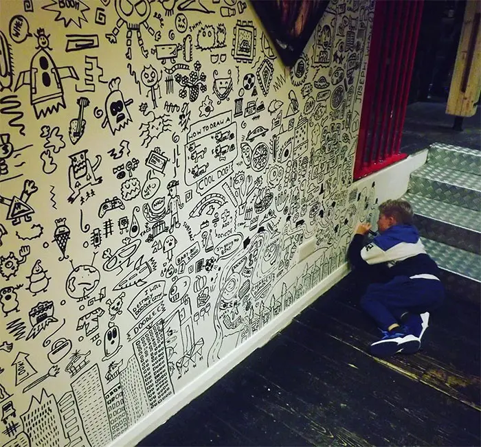 Joe Whale on the Verge of Completing His Wall Doodles 2