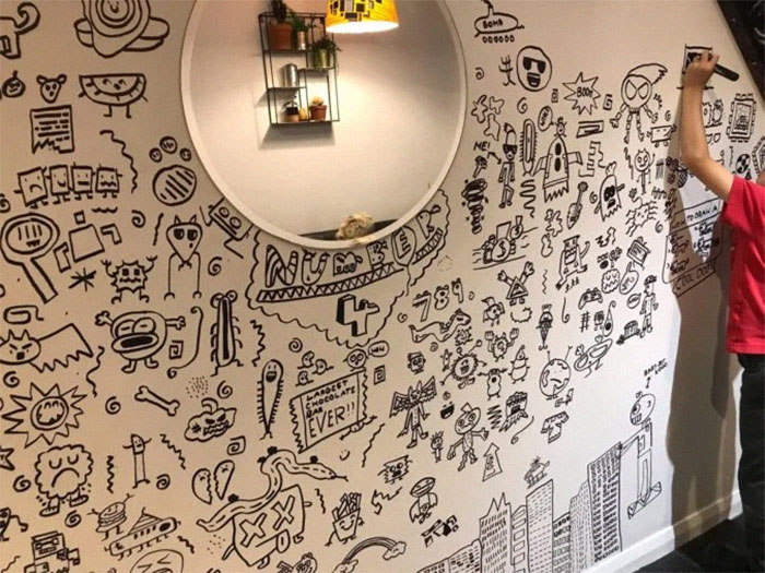 Joe Whale on the Verge of Completing His Wall Doodles