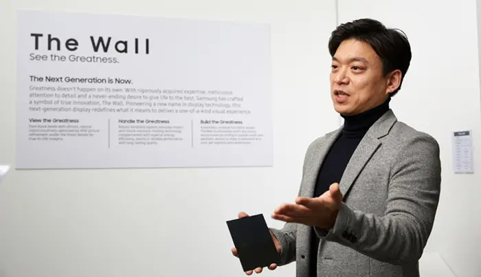 Samsung Product Planner Sungwan Koo Holding a Screen Module