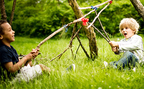 Two Boys Playing with Stick Swords