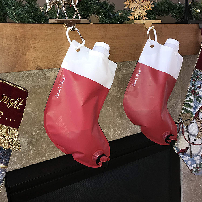 Two Santa's Flasks Hanging by the Fireplace