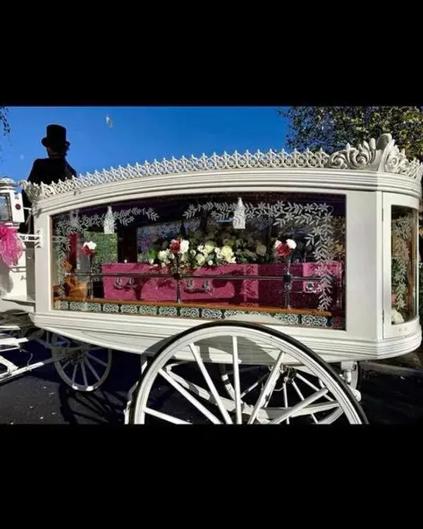 White Hearse with a Pink Glittery Casket