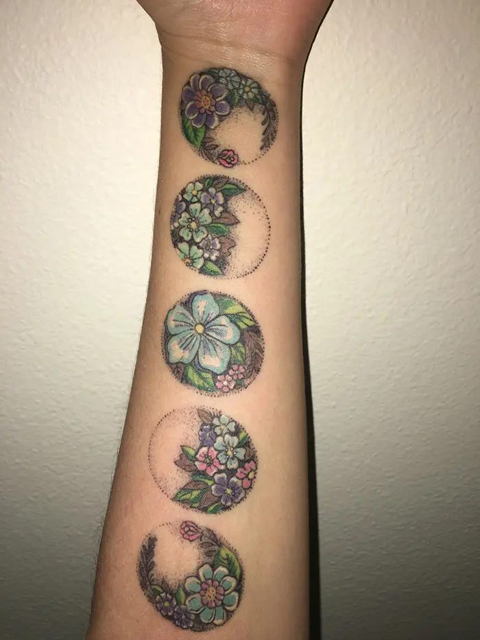 unusual tattoos floral moon