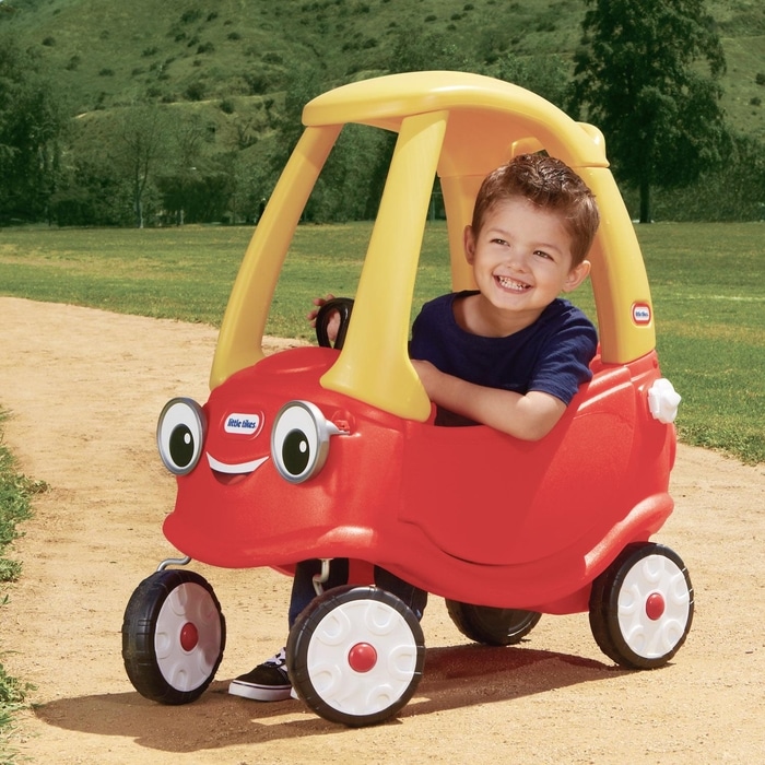 Boy in a Cozy Coupe