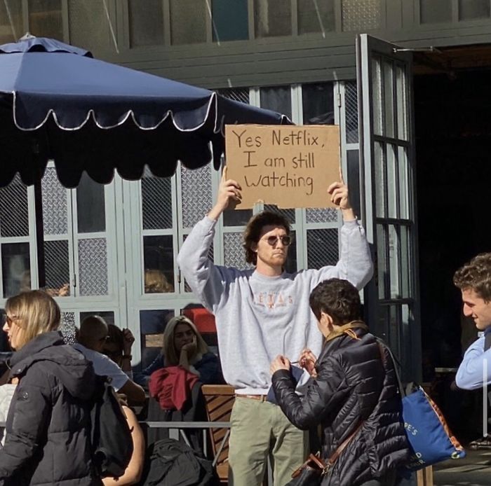 dude with sign netflix