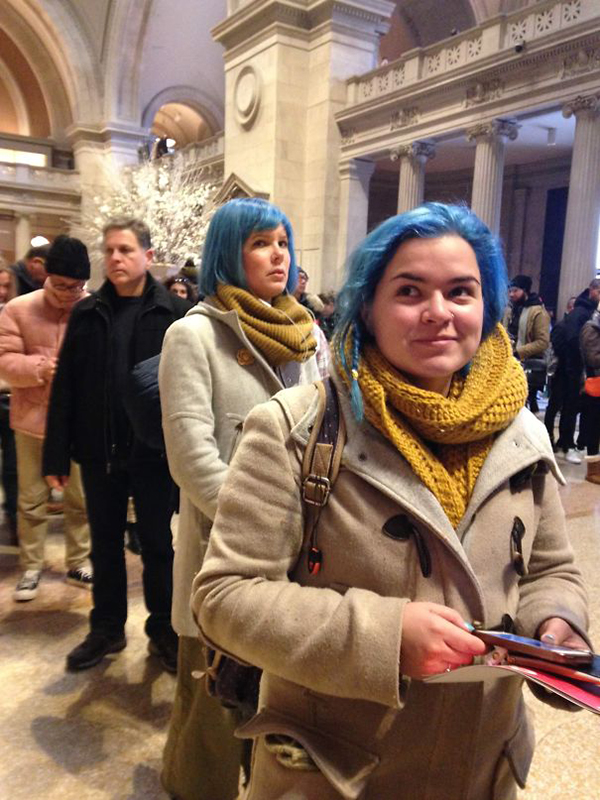 two ladies with blue hair and cream coats at the met