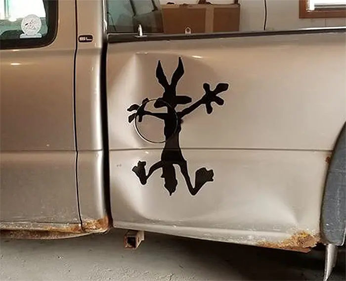 wile-e coyote car dent vinyl decal close up