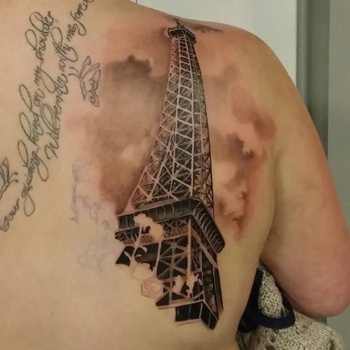 Eiffel Tower with Clouds Tattoo on Back