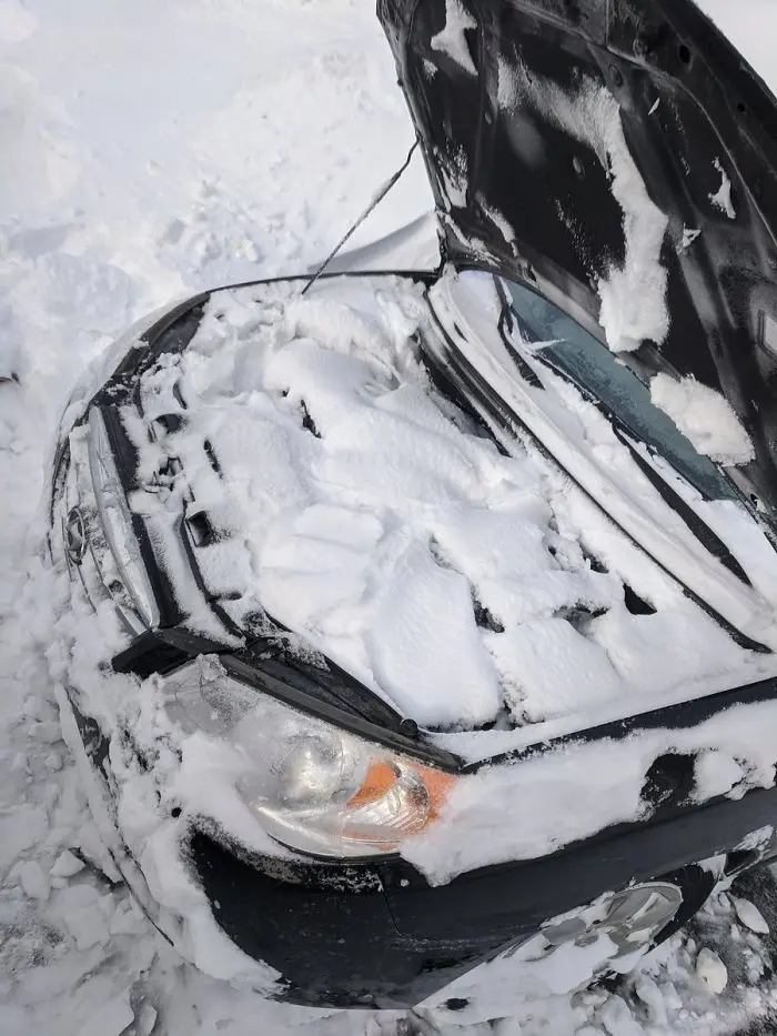 canada blizzard car hood frozen