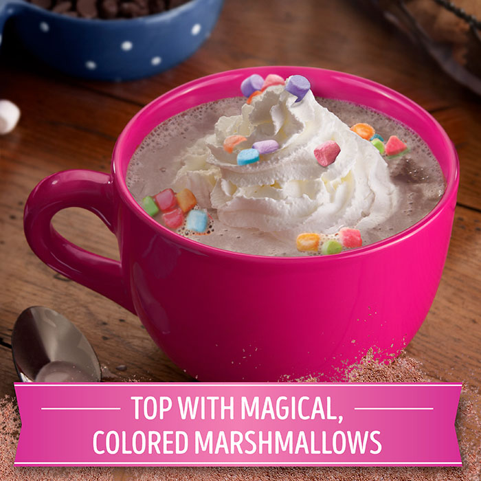 hot cocoa topped with a swirl of whipped cream and colorful marshmallows