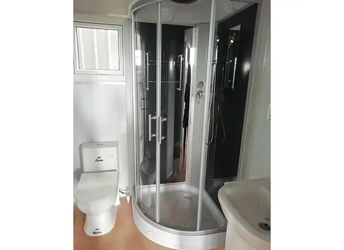 luxury toilet and shower installation at the expanding tiny home
