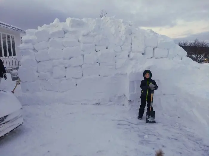 newfoundland blizzard shoveling piles of snow