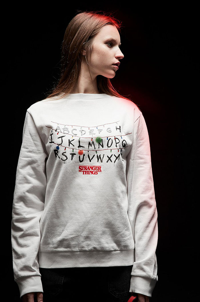 string of lights and letters sweater