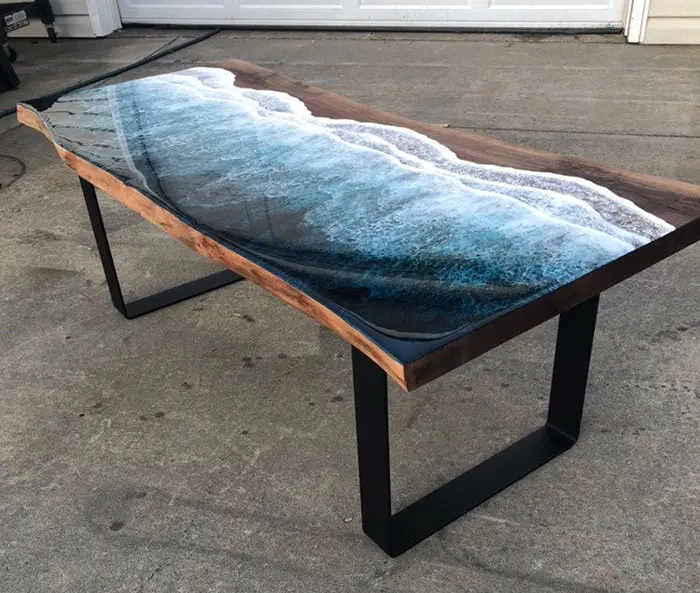wooden table with crashing wave resin desing