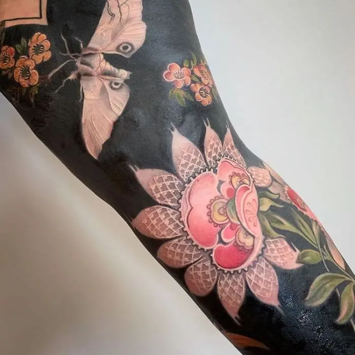 Flowers and Moth Blackout Tattoo by Esther Garcia