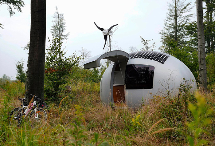 Ecocapsule and Bicycle in the Forest