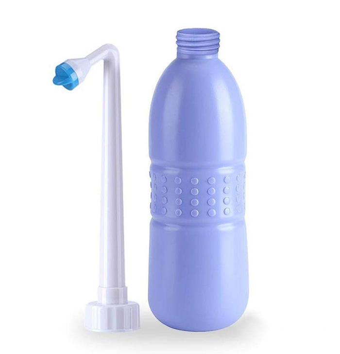 handheld hygiene bottle with angled nozzle